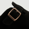 The Amber Clog hervelora (7) "Front Hero: Olive suede buckle-strap mule clog with cork-effect sole, side profile on plain background Beach Lifestyle: Woman wearing tan suede buckle mules walking on sand, open-back clog silhouette visible Detail Shot: Close-up of adjustable gold buckle strap and molded arch footbed on suede mule clog"